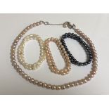 Pink, white and grey pearls - A necklace and three bracelets.