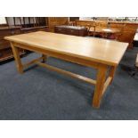 A contemporary oak refectory oak dining table