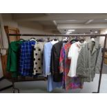 A rail of lady's designer clothing, jacket and skirt, Hobbs of London two piece set,