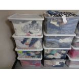 Eight plastic crates of lady's clothing