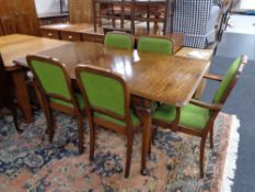 A twentieth century mahogany Queen Anne style extending mahogany dining table with leaf together