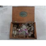 A wooden cigar box containing pre decimal coins and crowns