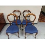 A set of eight Victorian mahogany dining chairs on cabriole legs