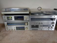 A Sanyo stereo component system together with four Pioneer hifi separates