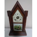 A late 19th century Gothic style eight day mantel clock by the Ansonia clock company