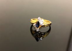 A yellow gold sapphire and diamond ring szie M.