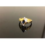 A yellow gold sapphire and diamond ring szie M.