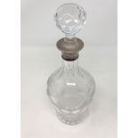A good quality silver mounted decanter engraved with grapes and vines