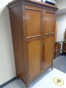An Edwardian mahogany double door wardrobe