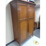 An Edwardian mahogany double door wardrobe