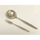 A George Jensen silver pickle fork and spoon