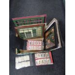 A box of cigarette cards in albums, frame and mounts,
