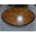 A Victorian inlaid mahogany oval table,