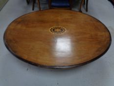 A Victorian inlaid mahogany oval table,