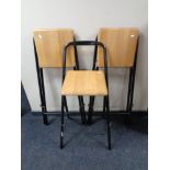 A set of three pine seated metal folding bar stools