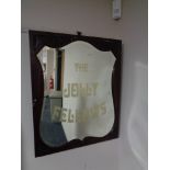 An Edwardian mahogany framed shield mirror 'The Jolly Fellows'