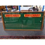 An early twentieth century and later oak framed double door notice board with Matchbox decoration