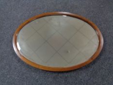 An Edwardian mahogany oval bevelled mirror