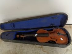 A twentieth century violin in coffin case