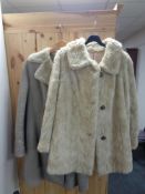 A faux fur coat and sheep skin coat