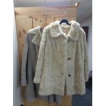 A faux fur coat and sheep skin coat
