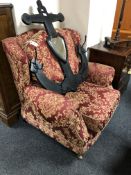 A reproduction Victorian style armchair in burgandy fabric