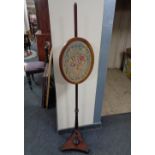 A Victorian tapestry pole screen on stand