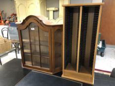 A continental single door wall cabinet and CD rack