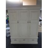 A Barker and Storehouse painted triple door wardrobe fitted with three drawers