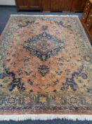A large Persian design carpet