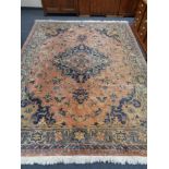 A large Persian design carpet