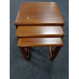 A nest of three twentieth century Sunelm teak tables