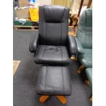 A black leather swivel relaxer chair with stool