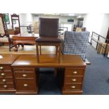 A contemporary dressing table with leather dining chair