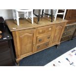 An early 20th century French oak sideboard, a/f CONDITION REPORT: Missing one handle.