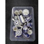 A box of Ringtons willow pattern china, tea services, storage jars,