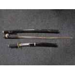 A Japanese style Katana in sheath with matching short sword