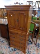 An inlaid yewwood cocktail cabinet fitted with slide and four drawers