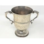 A George III silver twin handled trophy cup, John Deacon, London 1772, engraved 'Presented to Mr.