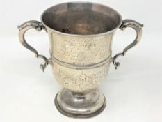 A George III silver twin handled trophy cup, John Deacon, London 1772, engraved 'Presented to Mr.