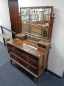 An Edwardian mahogany four drawer dressing chest