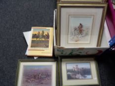 A box of nine Charles Russell prints depicting Cow boys and Native Americans with accompanying book