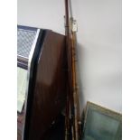 A bundle of vintage fishing rods,