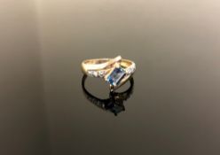 A 10ct gold emerald cut Neptune Topaz and diamond ring size M