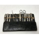 An eleven piece manicure set including seven silver mounted items knife etc