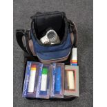 A tray of Hitachi video camera in bag,