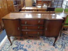 A mahogany Queen Anne style sideboard