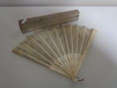 A vintage carved bone hand fan in box