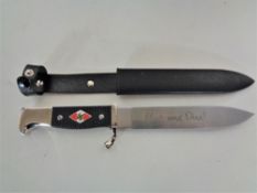 A replica German WW II knife in sheath