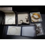 A box of 9ct gold baby bangle together with other silver and costume jewellery